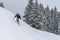 Snowboarder rides from powder snow hill. Mountain freeride snowboarding. Winter Carpathians