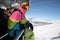 Snowboarder riding chair lift at ski resort