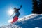 Snowboarder Riding Red Snowboard in Mountains at Sunny Day. Snowboarding and Winter Sports