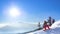 Snowboarder Riding Red Snowboard on the Slope in the Morning Mountains at Sunny Weather. Snowboarding and Winter