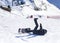Snowboarder on the ski run. Fall of a snowboarder