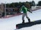 Snowboarder slides on rails