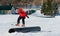 Snowboarder slides on rails
