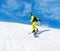 Snowboarder sliding down the hill, snow mountains