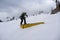 Snowboarder sliding a rail