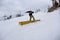 Snowboarder sliding a rail