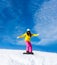 Snowboarder sliding woman down hill, snow