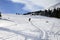 Snowboarder on snow off-piste slope with snowboard in hands at s