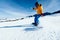 Snowboarder snowboarding in winter mountains