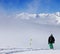 Snowboarder on snowy slope with new fallen snow