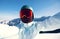 Snowboarder taking selfie while snowboardingon winter mountain top slope