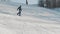 Snowboarder technically carves down the hill and performs an indie grab trick