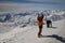 Snowboarder walking with a snowboard in the winter. Ski touring in the snowy mountains on a sunny day