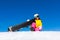 Snowboarder woman sitting on snow mountain slope