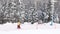 Snowboarders climb the slope on the rope lift. Winter forest background. Winter active outdoor sports recreation. WEB banner