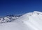 Snowboarders and skiers downhill on off piste slope