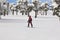 Snowboarding on a forest ski slope. White winter mountain landscape