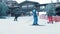 Snowboarding - people skating near the snowboarding base building