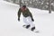 Snowboarding on a snow forest landscape. Winter sport