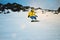 Snowboarding at sunset in mountains