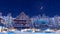 Snowbound alpine mountain village at winter night