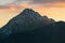Snowcap mountain against colorful sunset sky background