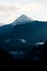 Snowcap mountains against cloudy sky background