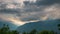 Snowcapped mountain ridges and peaks with moving clouds over the Alps in summer, Torino Province, Italy. Time lapse.