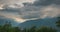Snowcapped mountain ridges and peaks with moving clouds over the Alps in summer, Torino Province, Italy. Time lapse.