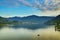 Snowcapped mountains overlooking calm lake at sunset