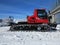 Snowcat on the mountain frosty winter day. Vehicle for preparing and clearing the slope on the winter resorts.