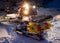 Snowcat preparing a slope in mountains