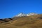 Snowcovered Volcano Tromen with full moon, Argentina