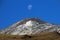 Snowcovered Volcano Tromen with full moon, Argentina