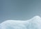 Snowdrift isolated on gray blue background close-up