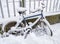 Snowed in bicycle in winter