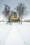 Snowed bridge to alone house in winter day