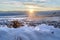 Snowed in hill overlooking frosted houses and lake in Draper Utah in winter