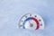 Snowed thermometer shows minus 9 Celsius degree cold winter weather concept
