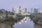 Snowfall along Bayou River bank and downtown Houston