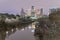 Snowfall along Bayou River bank and downtown Houston