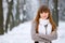 Snowfall in the forest, the girl smiles and poses, a beautiful winter, a great New Year mood