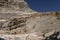 through a snowfield in the pyrenees towards the breach of rolando in summer