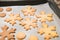 Snowflake cookies, baking on the baking sheet. Christmas gingerbread homemade. Merry Christmas card