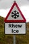 Snowflake ice triangular warning sign, bilingual Rhew, Wales, Un