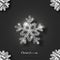 Snowflake with sparkles and highlights on a black background. Greeting Christmas card.
