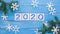Snowflakes on blue wooden background with 2020 - 2021 over white background - represents the new year 2021 , stop motion