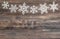 Snowflakes border over wooden background. christmas decoration