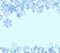 Snowflakes falling, light blue background