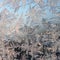 Snowflakes frost rime macro on window glass pane